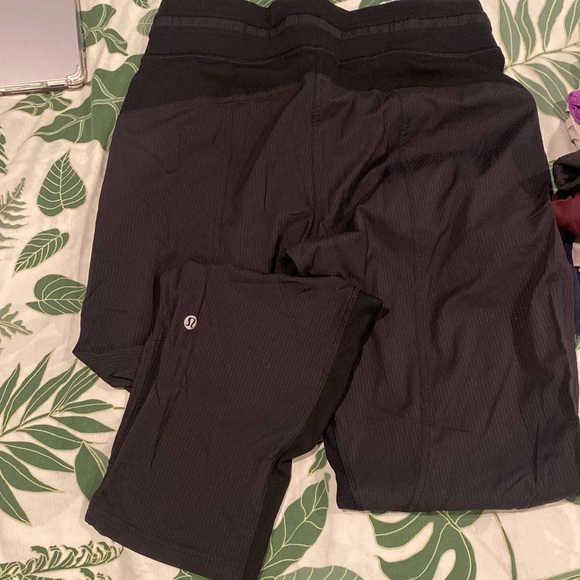 Bundle of lululemon women’s clothes: sports bras, running shorts, and leggings. - Picture 6 of 8